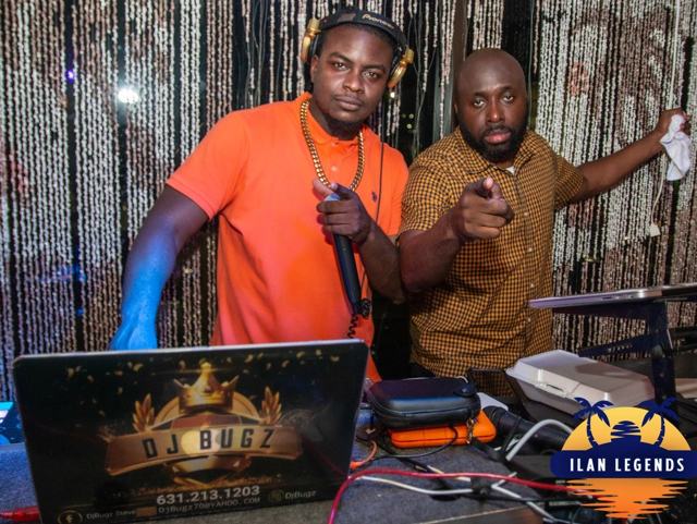 DJ Bugz and a guest at the DJ booth