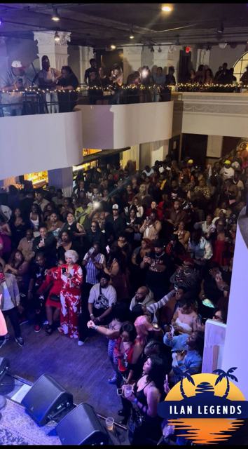 A packed two-level crowd at an iLan Legends event
