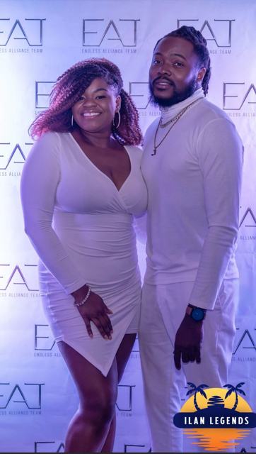 A couple posing at the photo booth
