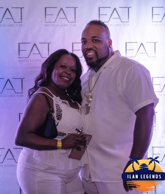 A couple smiling at the photo booth