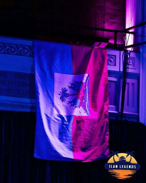 A Haitian flag hanging by the stage