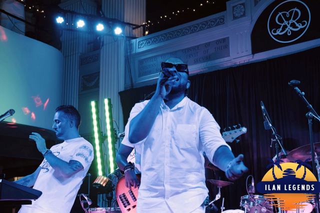 A vocalist and keyboardist on stage