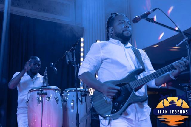 The guitarist and percussionist on stage