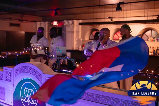 A Haitian flag waving by the DJ booth