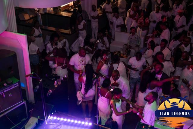 The dance floor packed with guests in white